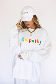 woman in white empathy always baseball hat